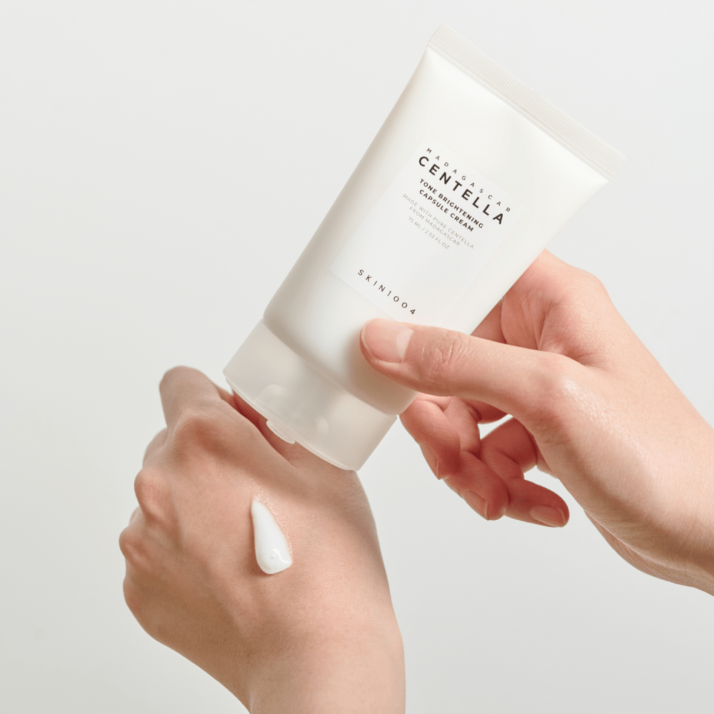 SKIN1004 Tone Brightening Capsule Cream applied on hand whitening cream