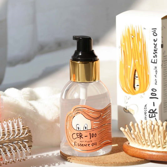 Elizavecca CER-100 Hair Muscle Essence Oil bottle on vanity table